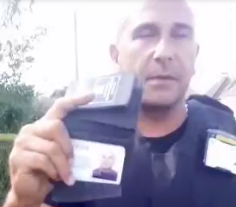 Bailiff displaying a fake police-like warrant card